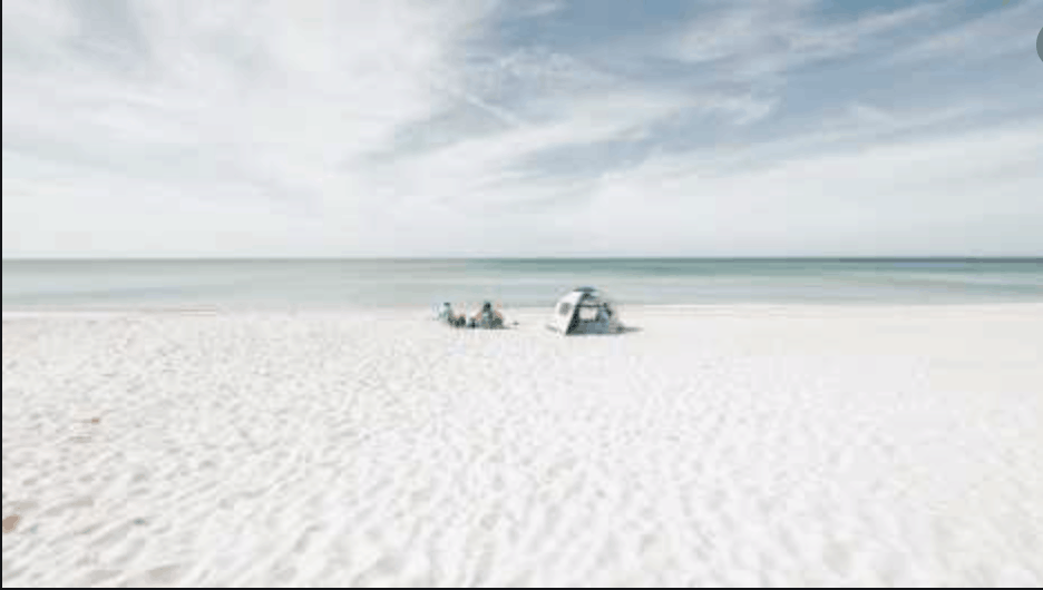 Two Sunbathers on Empty Siesta Sand